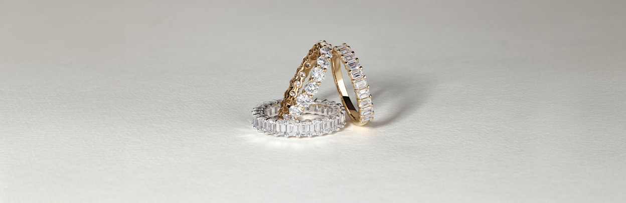 Wedding bands flatlay yellow gold and white gold with diamonds